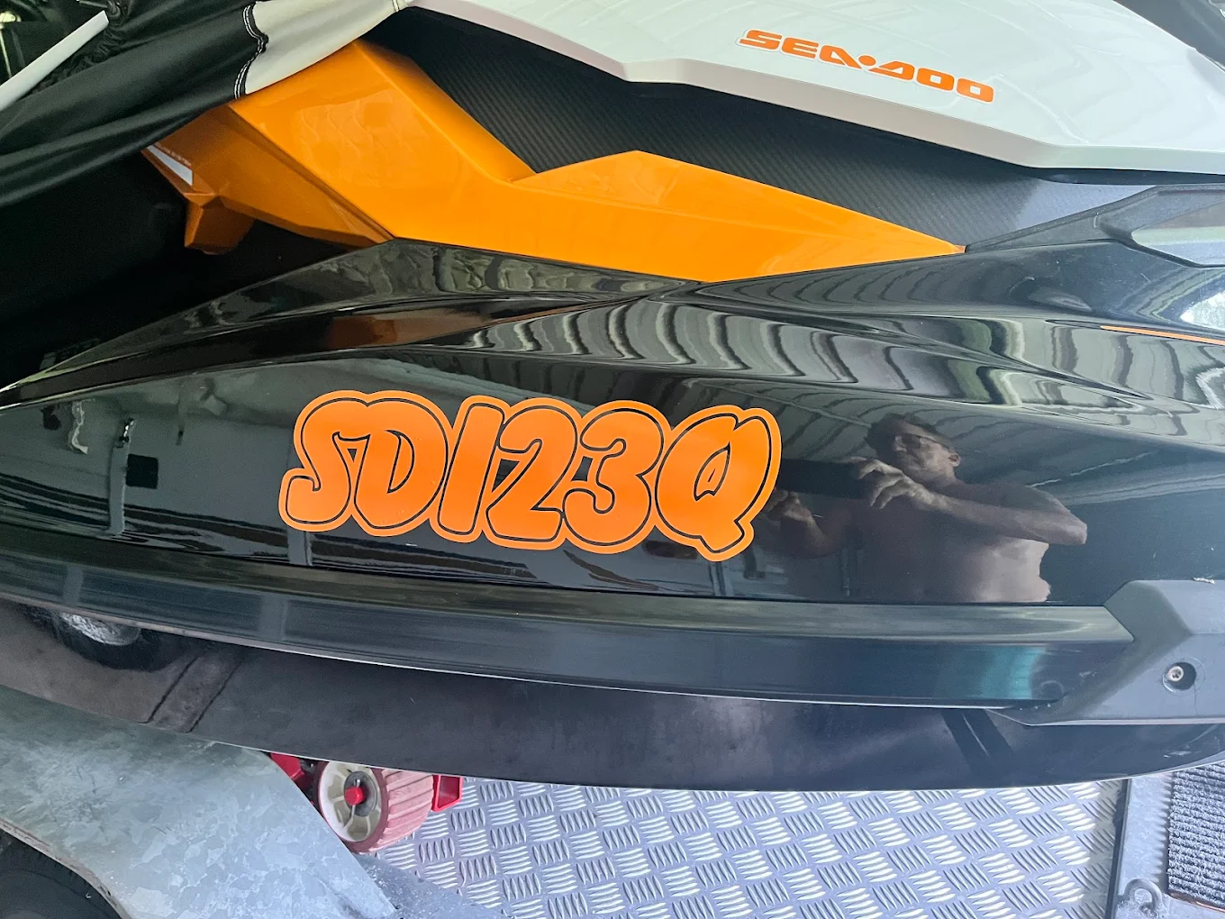 Jet ski with rego stickers on hull – PWC registration numbers