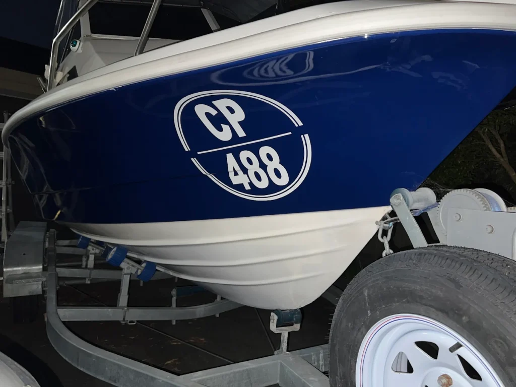 Round boat rego sticker example on vessel